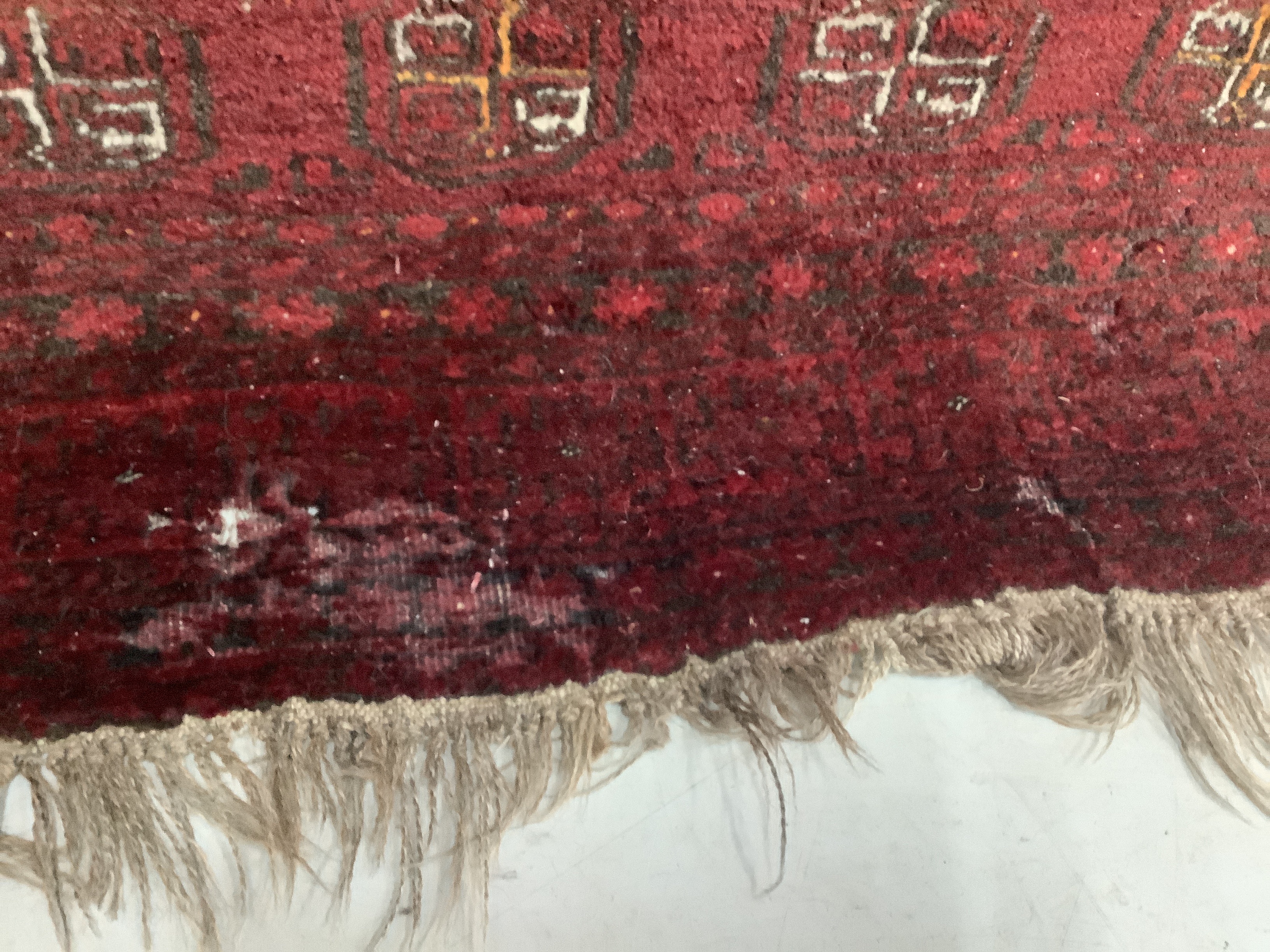 A Bokhara red ground carpet, 240 x 156cm